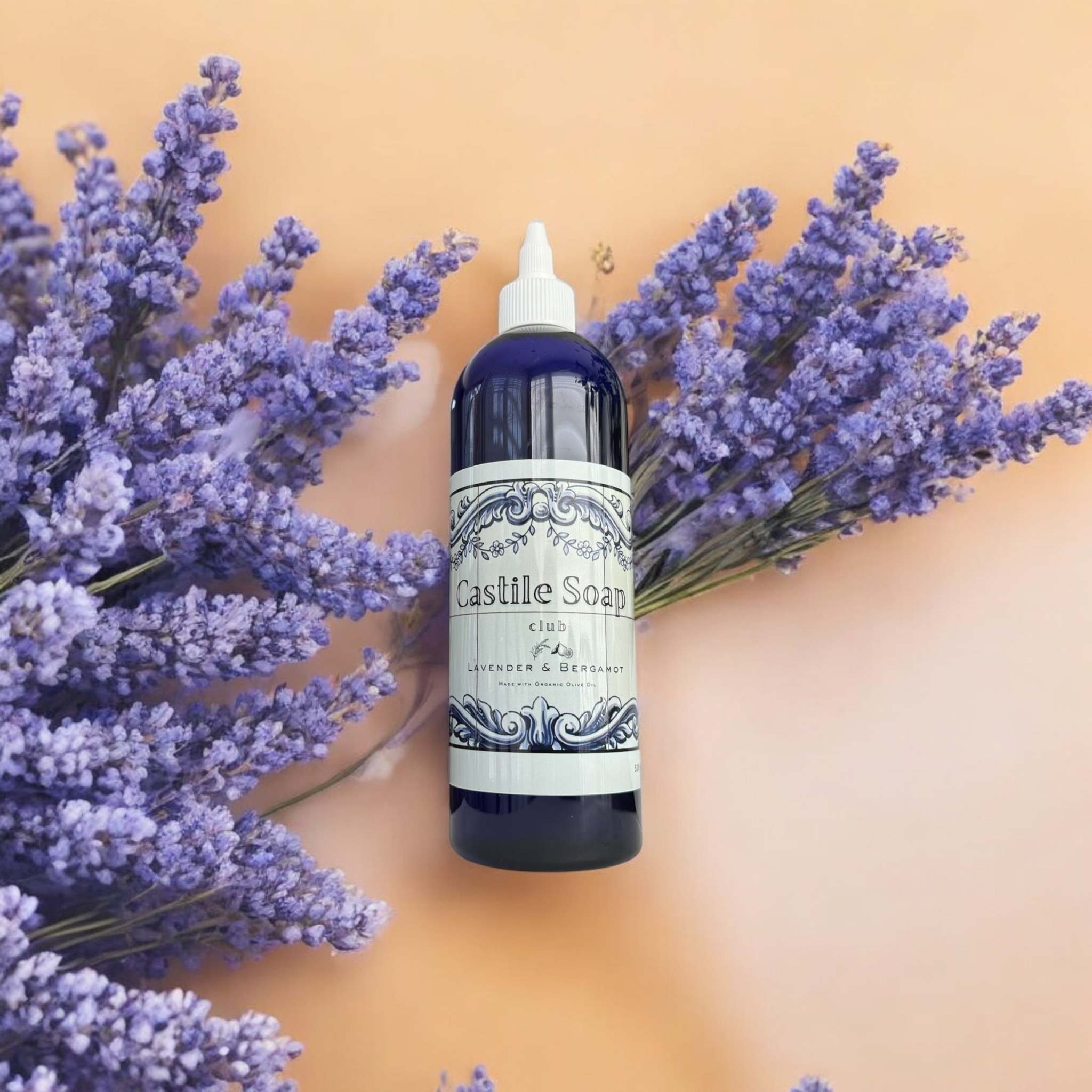 Lavender & Bergamot Organic Castile Liquid Soap bottle with lavender sprigs.