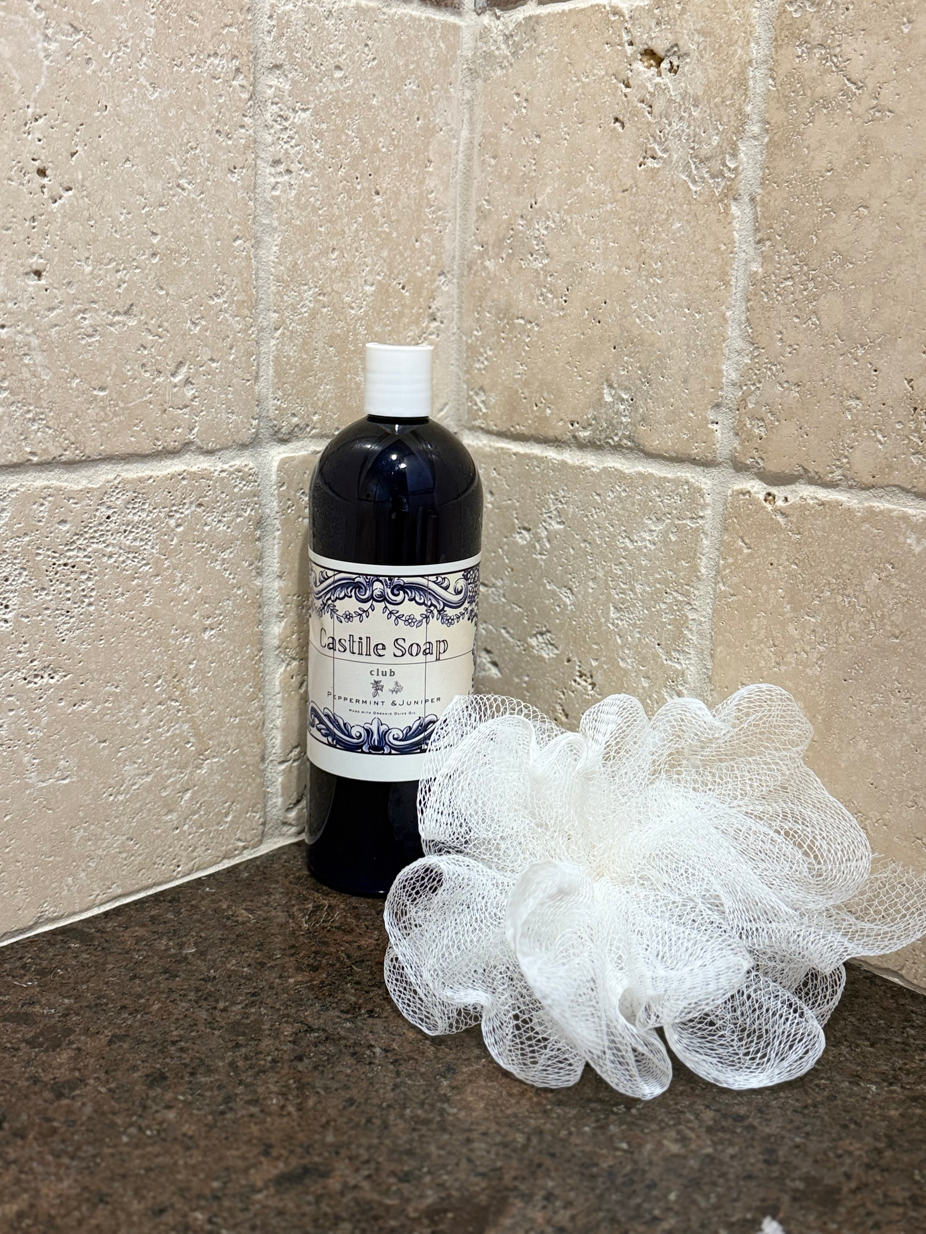 Castile soap bottle in shower for gentle hand and body cleansing
